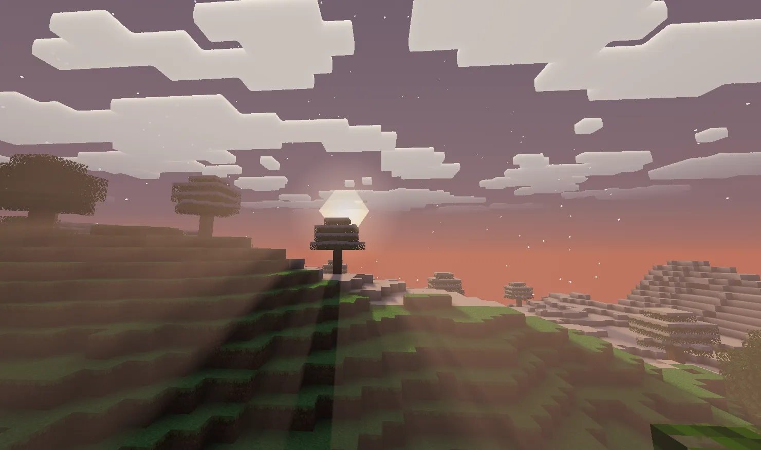 Volumetric light at sunset viewed from a mountain with deep warm tones